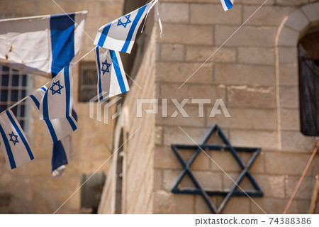 Israeli flag blowing in the wind Israeli flag blowing in the wind 74388386