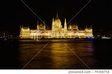 Budapest parliament at night near the Danube river Budapest parliament at night near the Danube river 74388758