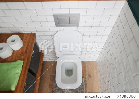Bathroom with toilet and washbasin. Basic requirements for public restrooms 74390396