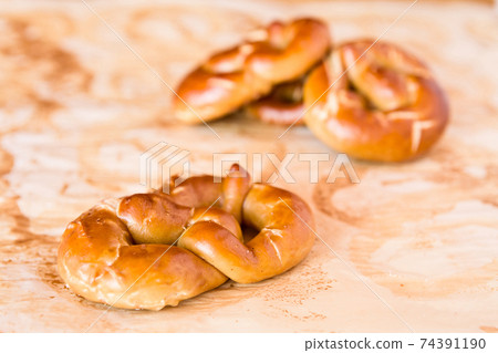 Closeup of cooked pretzel Closeup of cooked pretzel 74391190