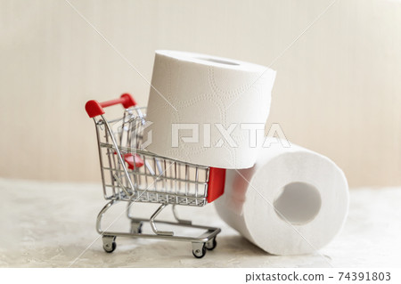 Rolls of toilet paper in Mini cart, trolley shopping. Concept of problem with consumer essential goods, hygiene, health Rolls of toilet paper in Mini cart, trolley shopping. Concept of problem with consumer essential goods, hygiene, health 74391803