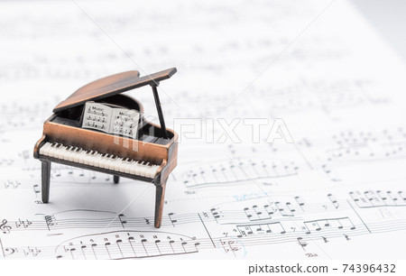 Grand piano and sheet music Indoor studio photography Grand piano and sheet music Indoor studio photography 74396432