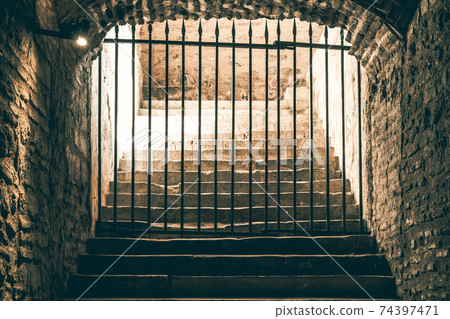 A daunting staircase leading to a passage  74397471