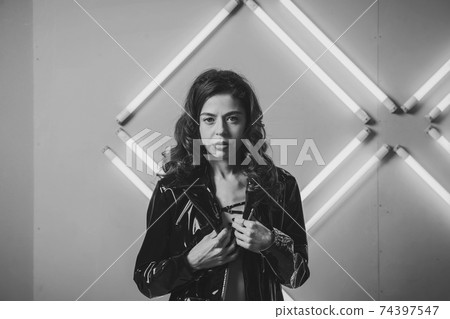 stylish woman wearing black leather jacket 74397547