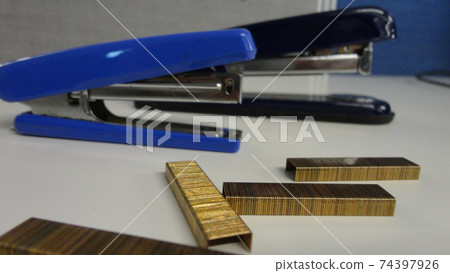 Metal staples for stapler isolated on the white office table. Office accessories on a white background 74397926