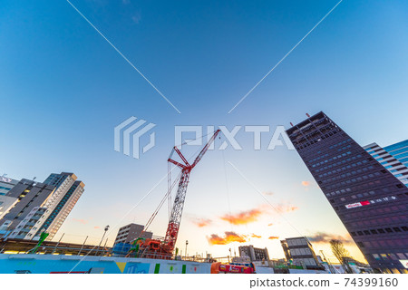 Tower crane under construction / evening 74399160