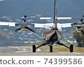 Behind a small plane 74399586