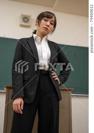 Teacher looking down Teacher looking down 74400612
