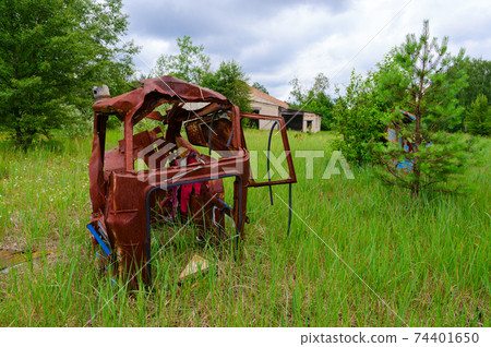 Abandoned agricultural machinery in mechanized yard of Victory of Socialism state farm in resettled village of Pogonnoye in Chernobyl exclusion zone, Belarus Abandoned agricultural machinery in mechanized yard of Victory of Socialism state farm in resettled village of Pogonnoye in Chernobyl exclusion zone, Belarus 74401650