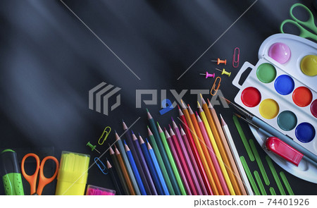 Blurred background of School office supplies on a table Blurred background of School office supplies on a table 74401926