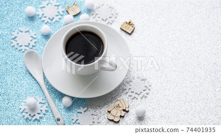 Blurred Christmas composition with a cup of coffee, snowflakes 74401935
