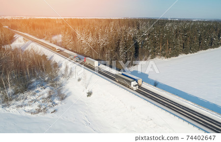 Cargo trucks on motorway 74402647