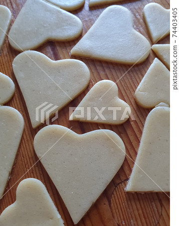 Homemade heart-shaped cookies. Wooden rustic background. Valentine's Day, greeting card, Copy space, top view, love 74403405