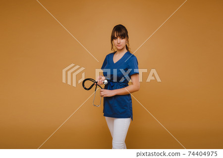 Cheerful happy doctor with crossed hands on blue background 74404975