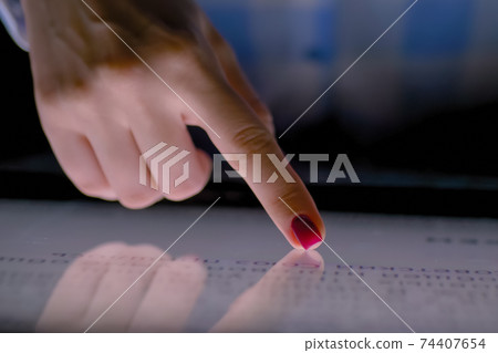 Woman finger using multimedia touchscreen display of interactive kiosk: close up Woman finger using multimedia touchscreen display of interactive kiosk: close up 74407654
