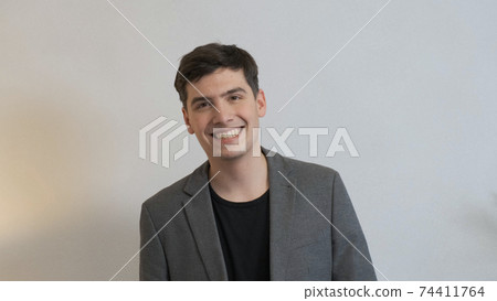 Happy businessman smiling. Good business concept. Happy businessman smiling. Good business concept. 74411764