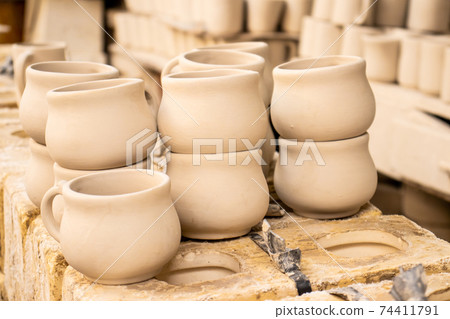 Clay injection molding technique at a traditional ceramics factory at the small city of Raquira in Colombia Clay injection molding technique at a traditional ceramics factory at the small city of Raquira in Colombia 74411791