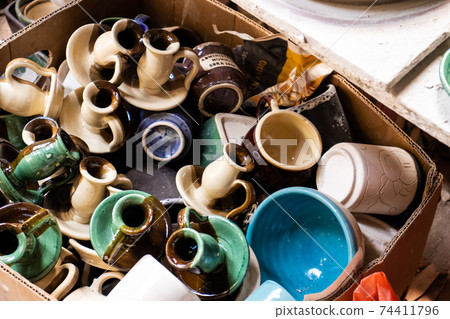 Ceramics on the elaboration process at a traditional factory at the small city of Raquira in Colombia Ceramics on the elaboration process at a traditional factory at the small city of Raquira in Colombia 74411796
