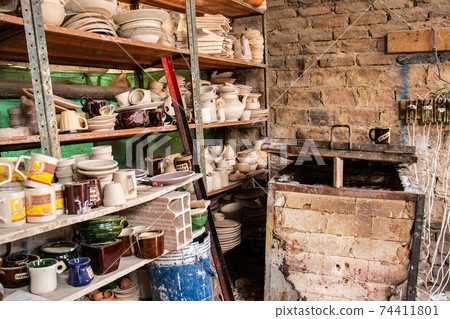 Ceramics on the elaboration process at a traditional factory at the small city of Raquira in Colombia Ceramics on the elaboration process at a traditional factory at the small city of Raquira in Colombia 74411801