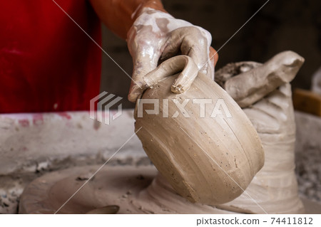 Ceramics on the elaboration process at a traditional factory at the small city of Raquira in Colombia 74411812