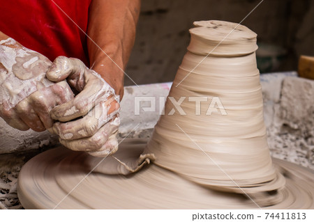 Ceramics on the elaboration process at a traditional factory at the small city of Raquira in Colombia Ceramics on the elaboration process at a traditional factory at the small city of Raquira in Colombia 74411813