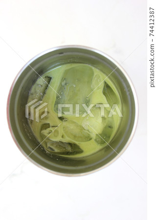 Iced Green Tea Coffee Latte or Matcha & Espresso Fusion on loft concrete 74412387