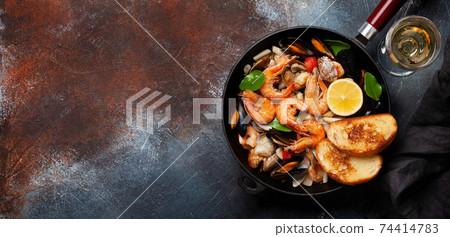 Mixed grilled seafood and white wine Mixed grilled seafood and white wine 74414783