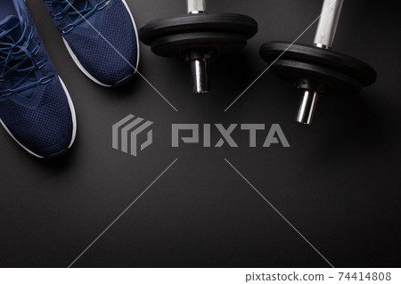 Sneakers and dumbbells. Sport, fitness and healthy lifestyle Sneakers and dumbbells. Sport, fitness and healthy lifestyle 74414808