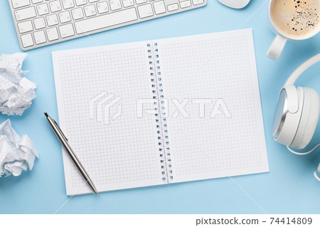 Office desk with supplies, coffee and blank notepad Office desk with supplies, coffee and blank notepad 74414809