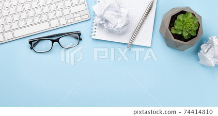 Office desk with supplies, plant and blank notepad Office desk with supplies, plant and blank notepad 74414810
