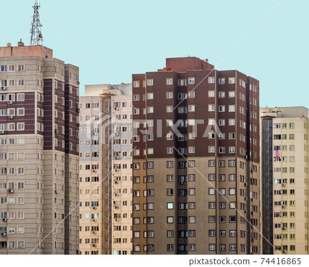 Ugly old impersonal skyscrapers in a suburb  74416865