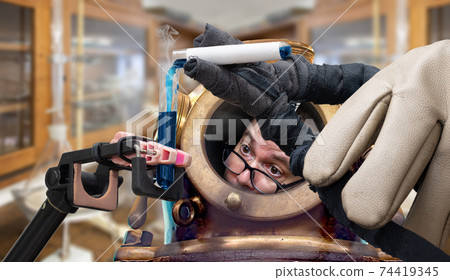 A frightened scientist pour a dangerous liquid to tube. A frightened scientist pour a dangerous liquid to tube. 74419345