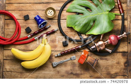 Smoking shisha with banana tobacco 74420978