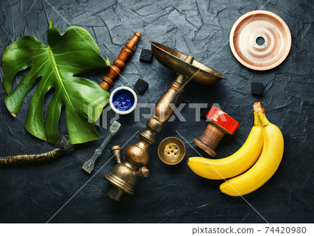 Smoking shisha with banana tobacco 74420980
