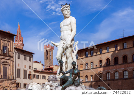 Famous Fountain of Neptune on the background of a beautiful blue sky. Florence, Italy Famous Fountain of Neptune on the background of a beautiful blue sky. Florence, Italy 74422932