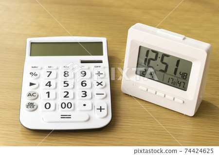 Calculator and clock. The time is money 74424625