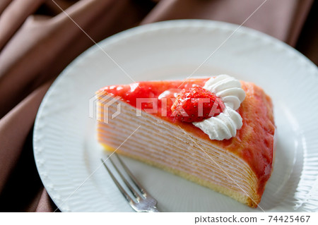 Strawberry mille crêpes served on a plate Strawberry mille crêpes served on a plate 74425467