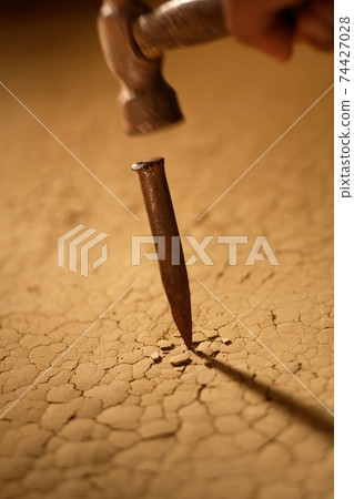 Chisel with a hammer Chisel with a hammer 74427028
