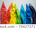 Rainbow colors in Pastry bags on White Surface 74427371