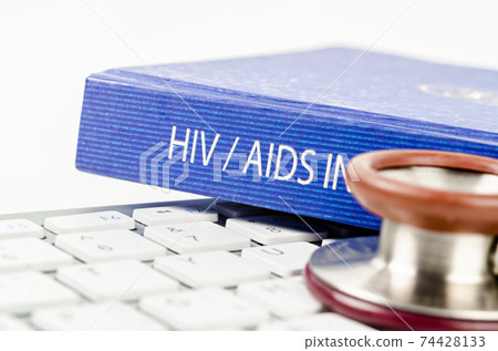 The book with HIV text and stethoscope medical on keyboard computer. The book with HIV text and stethoscope medical on keyboard computer. 74428133