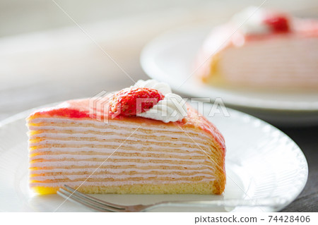 Strawberry mille crêpes served on a plate 74428406