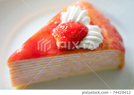 Strawberry mille crêpes served on a plate 74428412