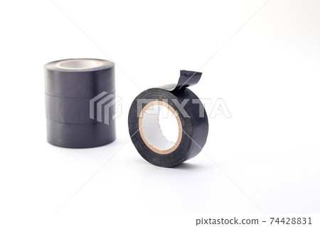 Rolls of black insulating tape isolated on a white background. 74428831