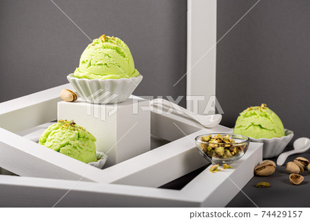 Scoop of homemade pistachio ice cream Scoop of homemade pistachio ice cream 74429157