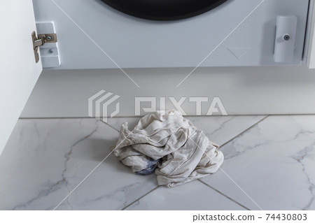 Rags for absorbing spilled water leaked from washing machine built into the kitchen furniture Rags for absorbing spilled water leaked from washing machine built into the kitchen furniture 74430803
