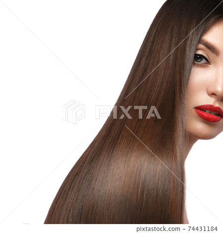 Beautiful brown-haired girl with a perfectly smooth hair, and classic make-up. Beauty face and hair. 74431184