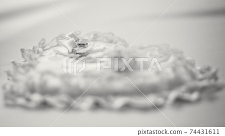 Wedding rings on fabric in form of heart, black and white 74431611