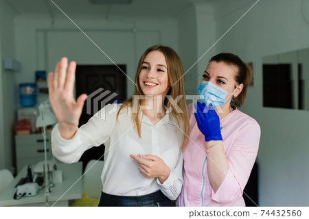 Female manicure master in a beauty salon work with hands of the client 74432560