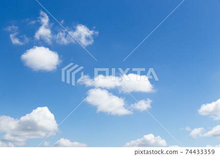 Clear blue color sky with white cloud background Clear blue color sky with white cloud background 74433359