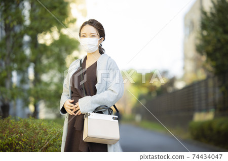 Pregnant woman mask outdoors Pregnant woman mask outdoors 74434047